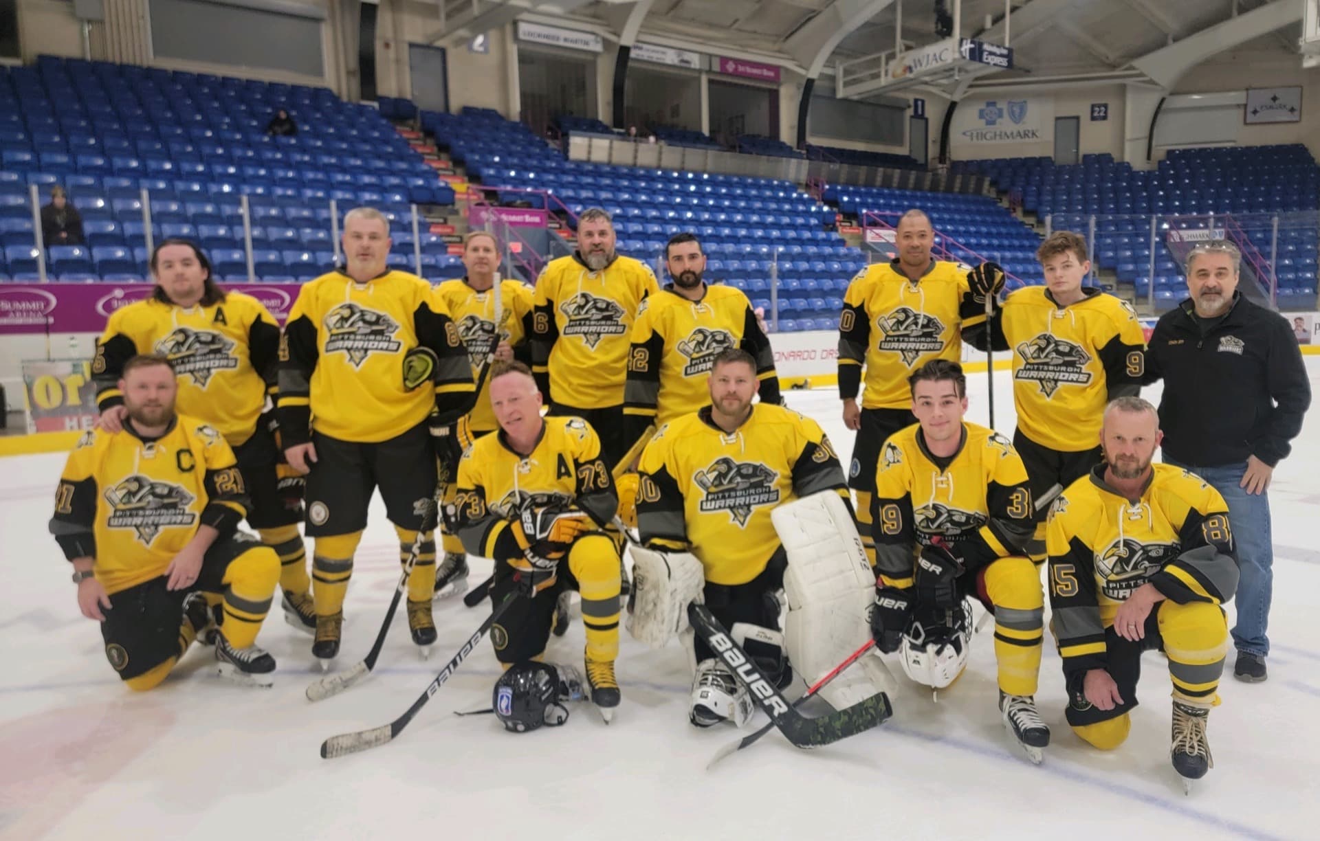 Pittsburgh Warriors team gathered on the ice before competition.