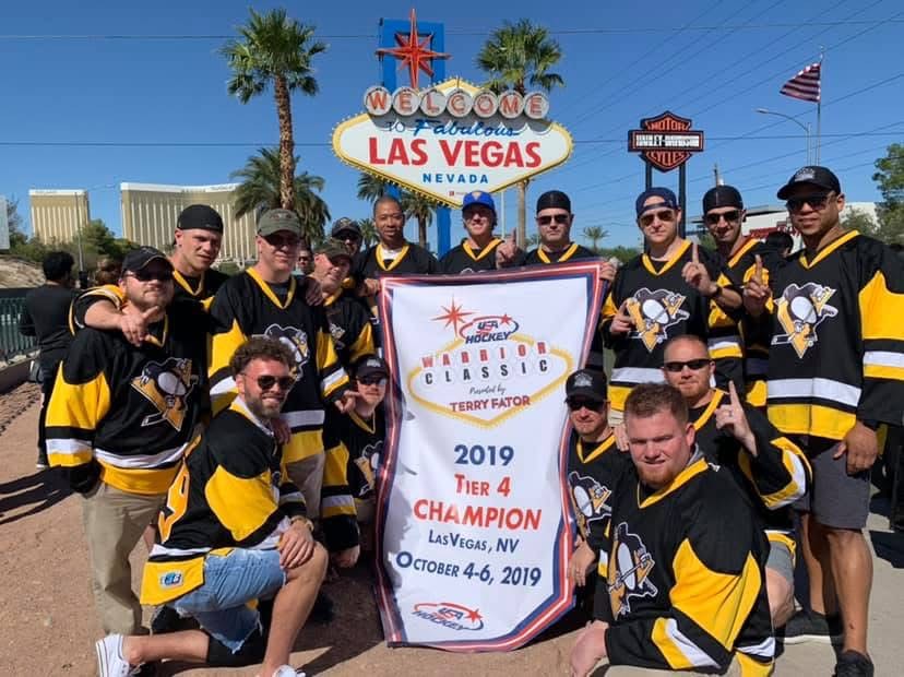 Players with the 2019 USA Hockey Warrior Classic sign in Las Vegas